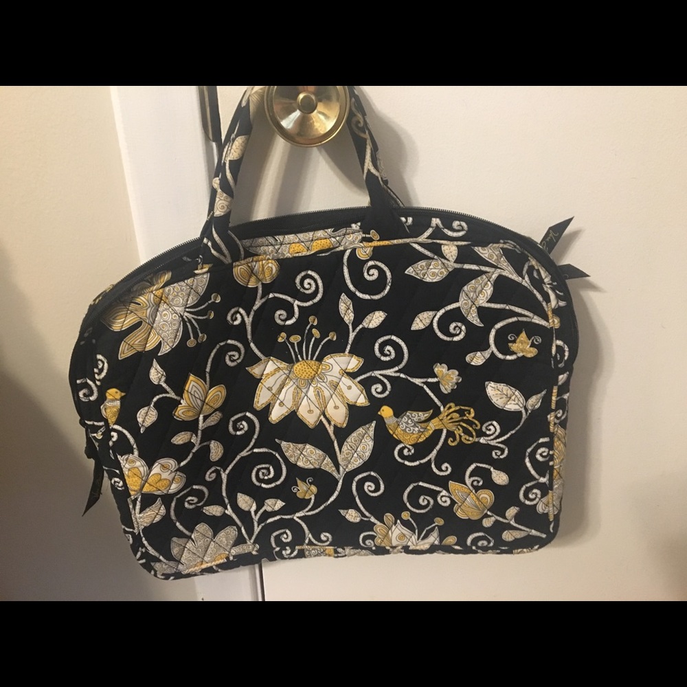 Vera Bradley.  Beautiful quilted laptop carry bag.